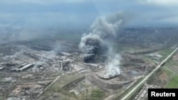 Smoke rises above the Azovstal steelworks in Mariupol. (file photo)