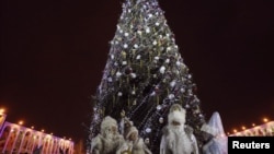 Father Frosts and Snow Maidens stand near a decorated tree in the Kyrgyz capital. (file photo)