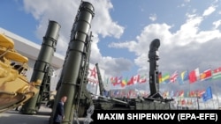 A visitor walks in front of a Russian Antey 4000 antiaircraft missile system at the International Military-Technical Forum Army-2021. 