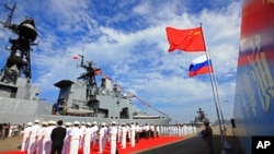 Marina chineză organizează o ceremonie de bun venit la sosirea unei nave rusești în Zhanjiang, sudul Chinei, în 2016.