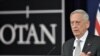 U.S. Defense Minister James Mattis gestures as he delivers a press conference during the second day of a defense ministers meeting at NATO headquarters in Brussels on November 9