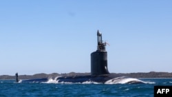 USS Minnesota (SSN-783), un submarin american de atac rapid din clasa Virginia, navighează în apele de pe coasta de vest a Australiei, pe 16 martie 2025.