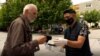 Kosovo: Volunteers give masks for free in downtown Prishtina.
