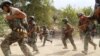Afghan soldiers take positions in restive Achin district in the eastern Nangarhar province on August 18. Afghan and U.S. forces are engaged in an operation against the Islamic State militants in August.
