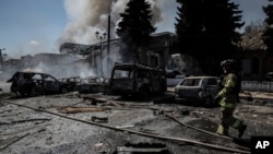 Firefighters put out a fire in a town in the Donetsk region on August 2. 