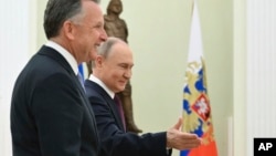 Stiv Uitkoff və Vladimir Putin