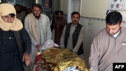 Pakistani relatives push a stretcher carrying the body of a victim at a hospital following cross border clashes between Afghan and Pakistani forces on May 5.