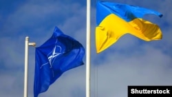 Ukraine – The national flag of Ukraine and NATO flag during the opening the teaching of the Ukraine-NATO disaster relief "Ukraine-2015". Lviv, 21Sep2015