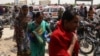 Relatives of victims arrive at the site of a deadly attack on a bus in Karachi that was carrying members of the Shi'a community. 