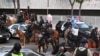 Policia i largon protestuesit nga rrugët e Los Anxhelosit pas hyrjes në fuqi të orës policore, 10 qershor.