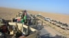 An Afghan army exercise in a rural district of Kandahar on August 17.