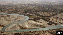 An aerial view shows the Helmand River in Afghanistan's Helmand Province. According to a 1973 agreement, Afghanistan is obligated to provide Iran with 850 million cubic meters of water annually from the Helmand River. 