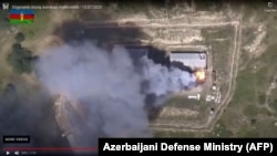 Фрагмент видеозаписи с места бонв на границе, опубликованной Минобороны Азербайджана