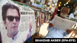 A Pakistani newspaper bears news of the general elections in Karachi on July 26.