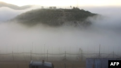 An Israeli patrol along Israel's border with Syria, as seen from the Druze village of Majdal Shams today