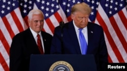 Претседателот на САД Доналд Трамп и потпретседателот Мајк Пенс.