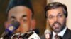 Mohammad Yunos Qanuni, flanked by an image of President Karzai (file photo)