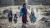 Children run to school in a village (file photo)