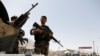 FILE: Afghan National Army (ANA) soldiers keep watch at a checkpoint on the Ghazni Province. 