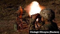 Soldiers from the Carpathian Sich volunteer battalion conduct maneuvers near the front line in Kreminna, Ukraine, on January 3.