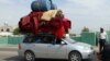 Afgani fugind din calea talibanilor în Helmand