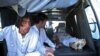 Pakistani relatives transport the body of a blast victim at a hospital after a bomb explosion at a market in Parachinar, the capital of Kurram tribal district, on December 13. 