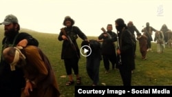Grab from a video that shows militants loyal to the Islamic State (IS) blowing up bound and blindfolded Afghan prisoners with explosives.