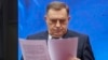 Predsednik Republike Srpske MIlorad Dodik čita sudsku presudu, 26. februar 2025.